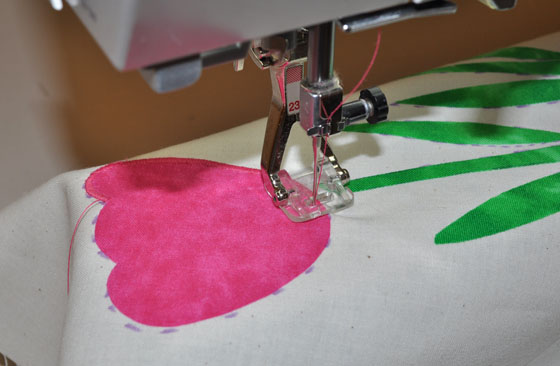 Stitch Applique Motif to Fabric Using a Satin Stitch